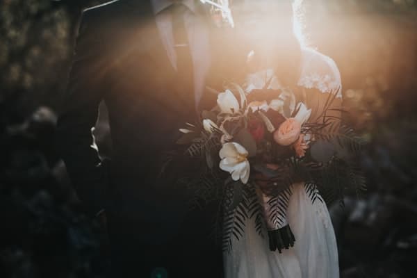 Arched wedding couple portrait